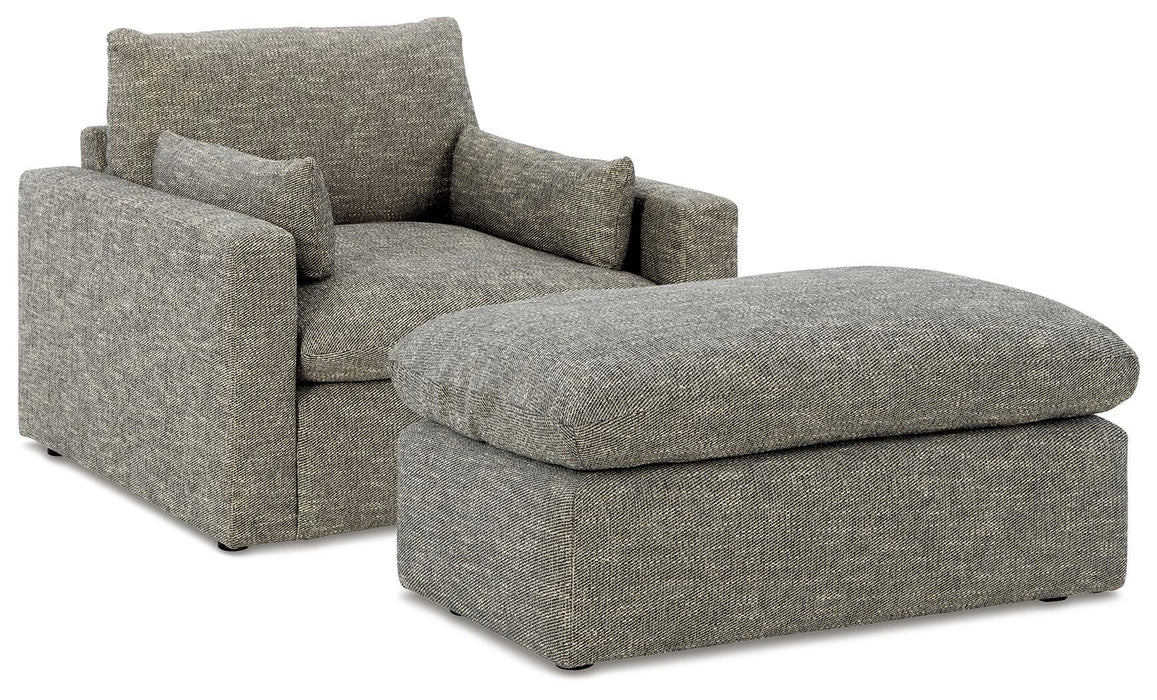 Elegant living room set by Ashley Furniture featuring a sofa, armchairs, and coffee table in a modern design.