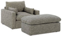 Elegant living room set by Ashley Furniture featuring a sofa, armchairs, and coffee table in a modern design.