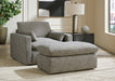 Ashley Furniture dramatic living room set with plush sofa, armchair, and coffee table in a stylish modern design.