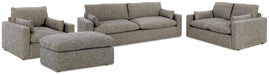 Ashley Furniture dramatic living room set with plush sofa, matching armchair, and stylish coffee table in a modern design.