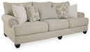 Ashley Furniture Asanti sofa in a living room setting, showcasing plush cushions and modern design from an angled view.