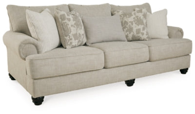 Ashley Furniture Asanti sofa in a living room setting, showcasing plush cushions and modern design from an angled view.