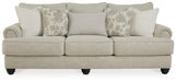 Ashley Furniture Asanti Sofa with plush cushions and elegant design, shown in a head-on view highlighting the fabric and structure.