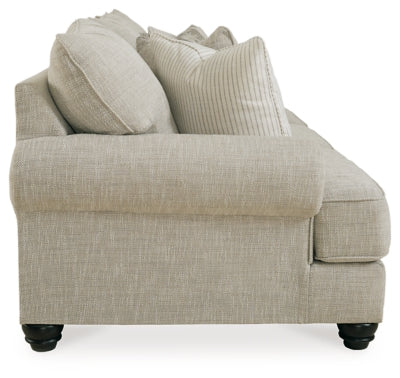 Ashley Furniture Asanti sofa with plush fabric and stylish design, shown in a side view highlighting its elegant cushions.