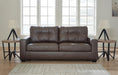 Ashley Furniture Barlin Mills Sofa with plush beige upholstery and rolled armrests, shown from the front.