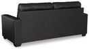 Ashley Furniture Barlin Mills sofa with plush back cushions and stylish upholstery, shown from the back in a cozy living room setting.