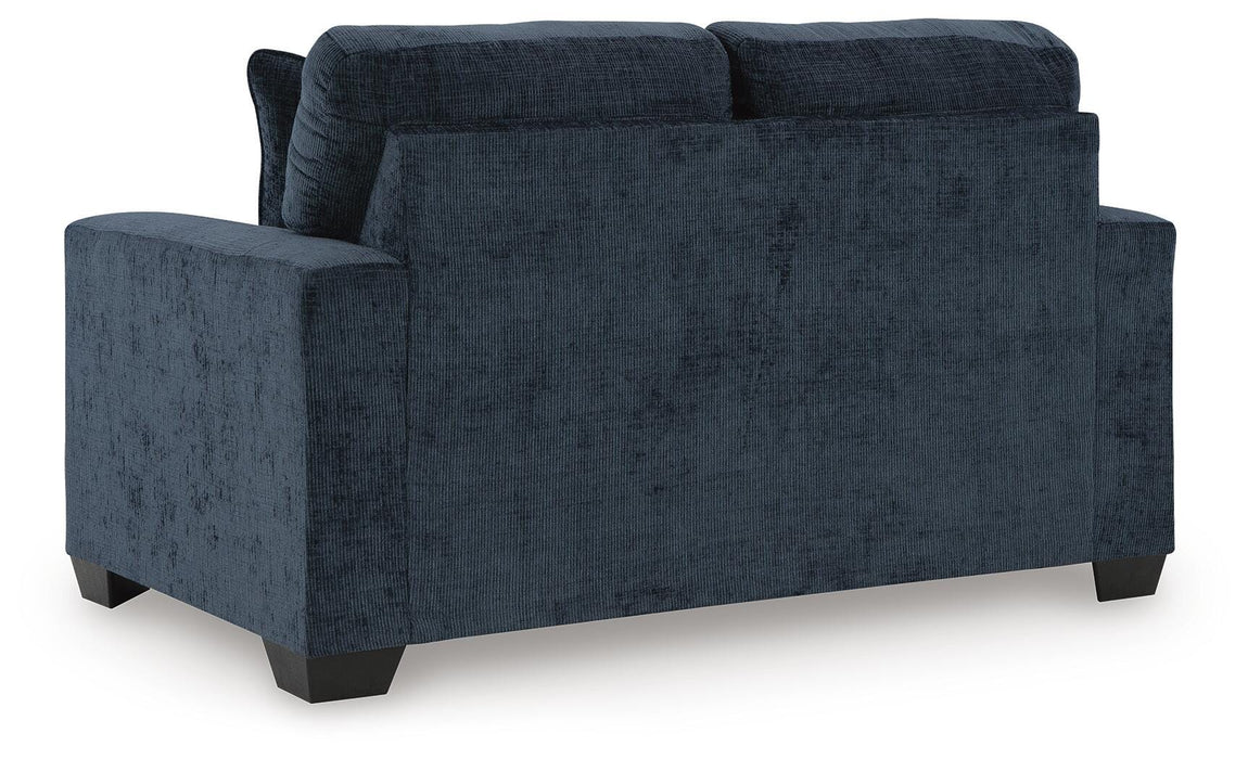 Ashley Furniture Aviemore loveseat with plush fabric, featuring a cozy backrest and comfortable seating for living room decor.