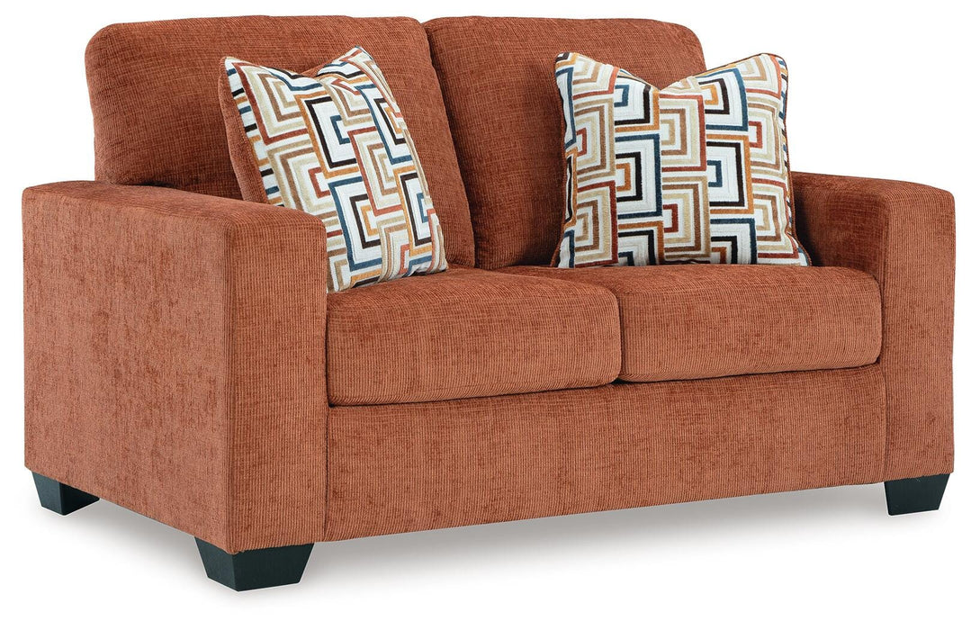 Ashley Furniture Aviemore loveseat with plush fabric, angled view showcasing comfortable seating and stylish design.