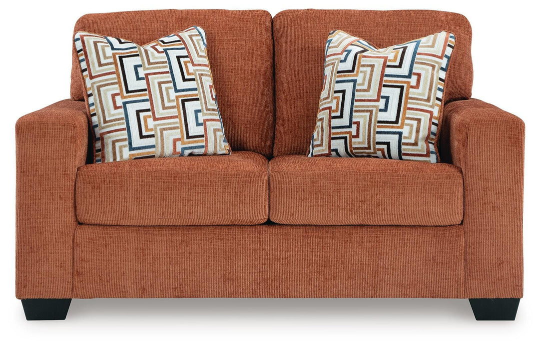 Ashley Furniture Aviemore loveseat with plush fabric upholstery and comfortable cushions, shown from the front.
