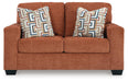 Ashley Furniture Aviemore loveseat with plush fabric upholstery and comfortable cushions, shown from the front.