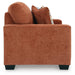 Ashley Furniture Aviemore loveseat with plush fabric and cushioned armrests, shown in a cozy, stylish living room setting.