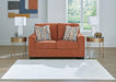 Ashley Furniture Aviemore loveseat with plush fabric and cushioned armrests, shown in a cozy living room setting.