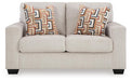 Ashley Furniture Aviemore loveseat with plush fabric and cushioned armrests, shown from head-on perspective.