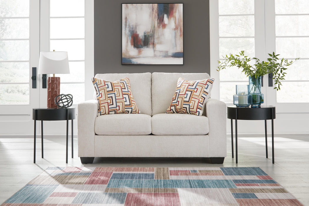 Ashley Furniture Aviemore loveseat with plush fabric and cushioned arms, perfect for cozy living room seating.