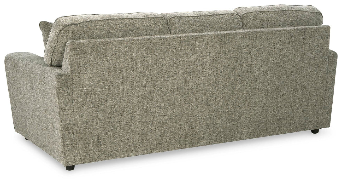 Ashley Furniture Cascilla sofa with plush cushions and fabric upholstery, shown from the back in a modern living room setting.