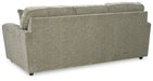 Ashley Furniture Cascilla sofa with plush cushions and fabric upholstery, shown from the back in a modern living room setting.