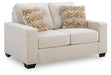 Ashley Furniture Larimer living room set with sofa and armchair, showcasing neutral fabric upholstery and wooden legs.