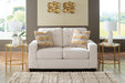 Ashley Furniture Larimer living room set with sofa and armchair in neutral fabric, modern design, and plush cushions.