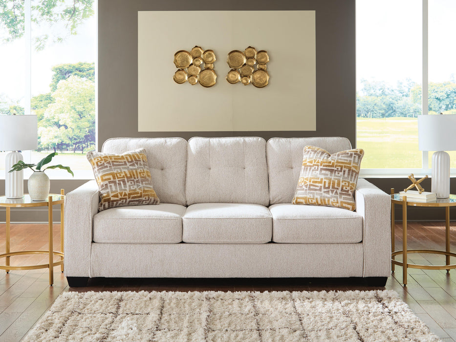Ashley Furniture Larimer living room set with sofa, loveseat, and armchair arranged in a cozy family room setting.