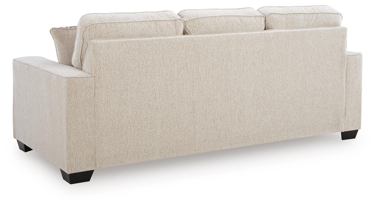 Ashley Furniture Larimer living room set showing a sofa with plush cushions and matching armchair in a modern design.
