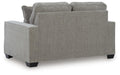 Ashley Furniture Larimer living room set with sofa and loveseat in a modern fabric, shown from the back in a stylish home setting.