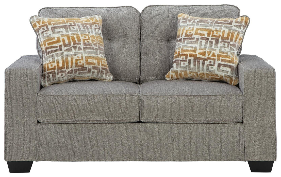 Ashley Furniture Larimer living room set with sofa and loveseat, featuring neutral fabric and modern design, shown in a cozy living space.