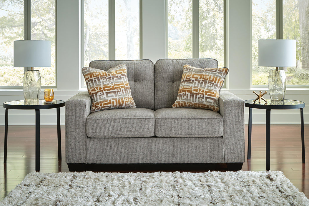 Ashley Furniture Larimer living room set featuring a sofa and loveseat with plush cushions and wooden legs, in a cozy fabric finish.
