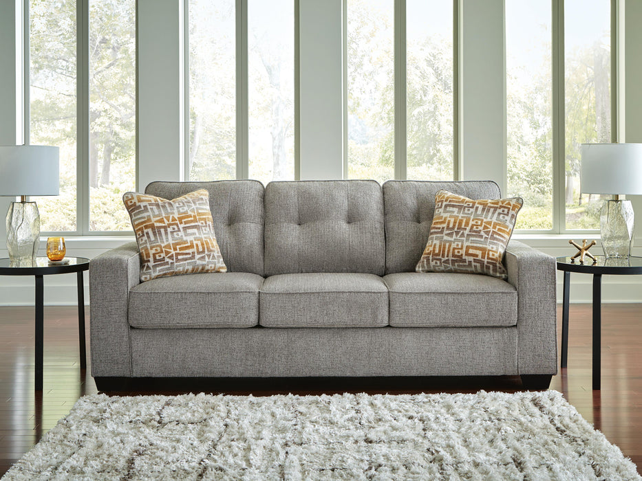Ashley Furniture Larimer living room set with beige fabric sofa and matching armchair in a modern living space