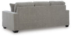 Ashley Furniture Larimer living room set featuring a sofa and loveseat with plush cushions and neutral upholstery, viewed from the back.
