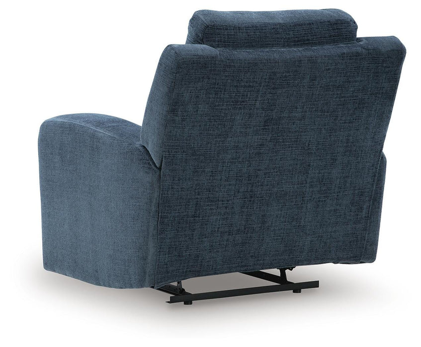 Ashley Furniture Danum recliner with plush upholstery and padded armrests, shown from the back with a modern design.