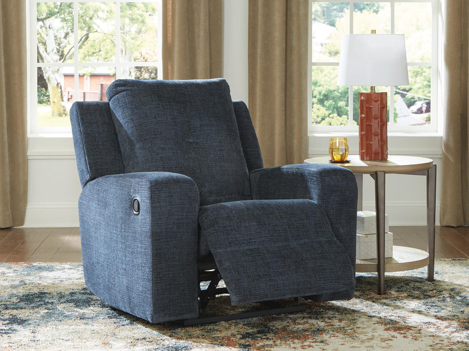 Ashley Furniture Danum Recliner in open position, gray fabric with plush cushioning and wooden legs, stylish and comfortable seating.