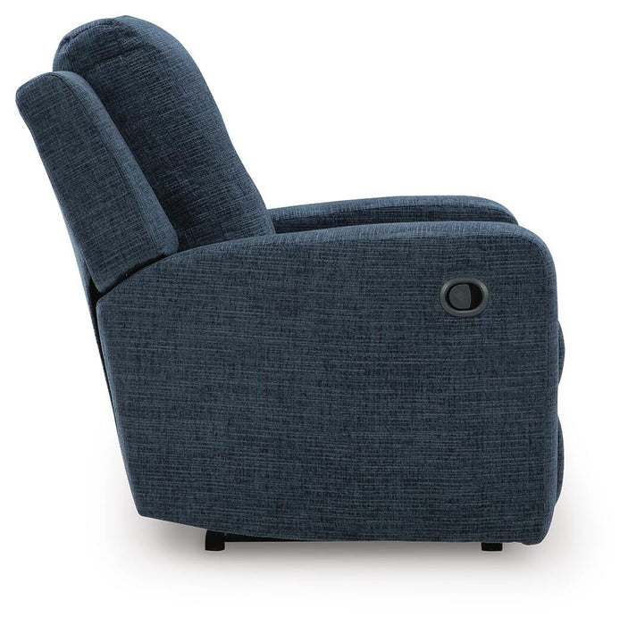 Ashley Furniture Danum recliner with plush fabric, padded armrests, and a modern design, shown from a side view.