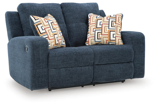 Ashley Furniture Danum Reclining Loveseat with plush fabric and reclining features, shown from an angled closed position.