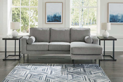 Ashley Furniture Hazela living room set featuring a sofa and armchair with neutral fabric upholstery and modern design.