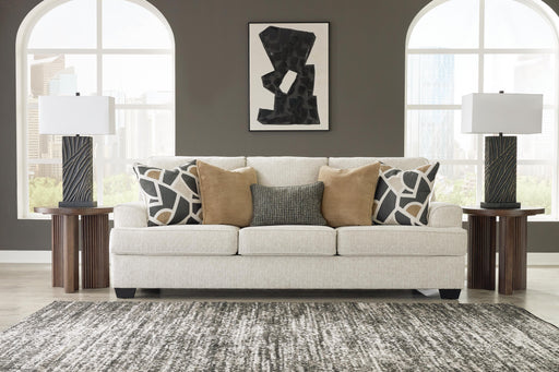 Ashley Furniture Heartcort sofa with plush cushions and neutral fabric, shown in a modern living room setting.