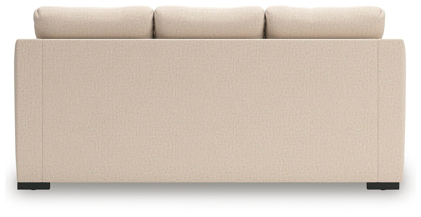 Ashley Furniture Lango Sofa Chaise, modern chofa with plush cushions and wooden legs, shown from the back with neutral fabric upholstery.