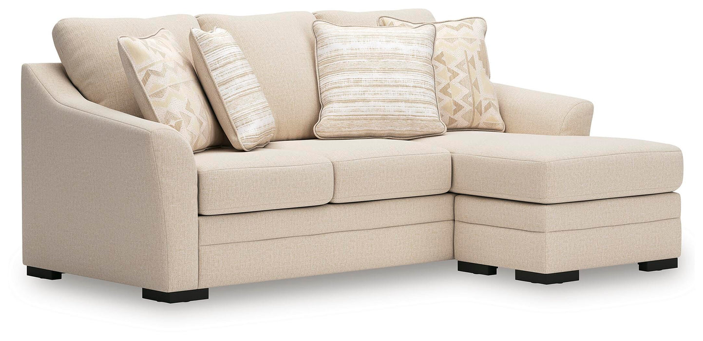 Ashley Furniture Lango sofa chaise sleeper with angled view, featuring plush cushions and a contemporary design.