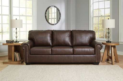 Ashley Furniture Colleton Sofa with plush cushions and fabric upholstery, shown in a modern living room setting.