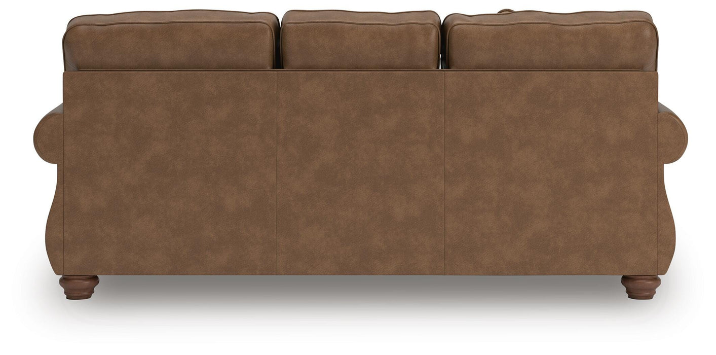 Ashley Furniture Chasemore Sofa with plush cushions and rolled arms, shown from the back in a cozy living room setting.