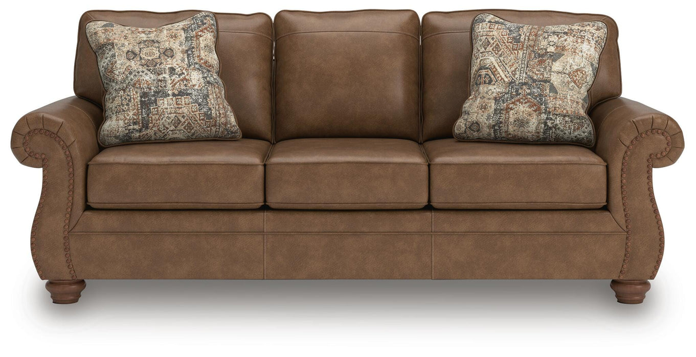 Ashley Furniture Chasemore sofa with plush beige upholstery and rolled arms, shown in a head-on view.