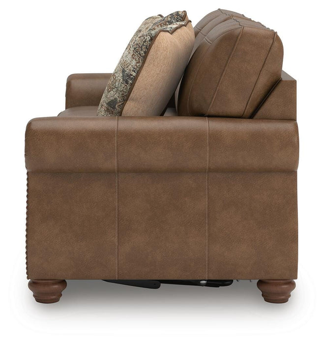 Ashley Furniture Chasemore sofa sleeper with beige fabric, showing the side view and convertible bed feature.