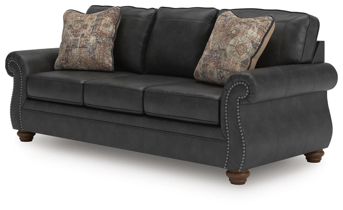 Ashley Furniture Chasemore sofa shown from an angled view, featuring plush cushions and stylish upholstery in a modern living room setting.