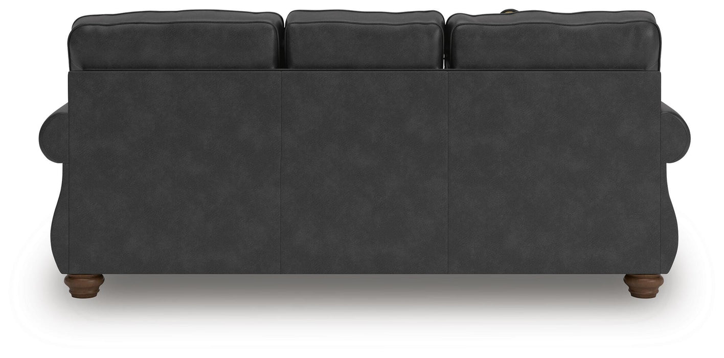 Ashley Furniture Chasemore sofa with plush cushions and wooden legs, shown from the back view.