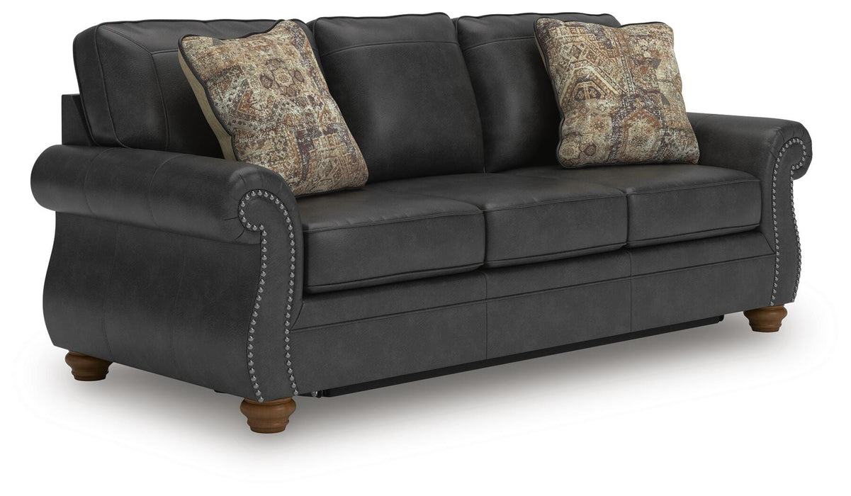 Ashley Furniture Chasemore sofa sleeper with beige fabric, featuring plush cushions and a fold-out bed for versatile seating and sleeping.