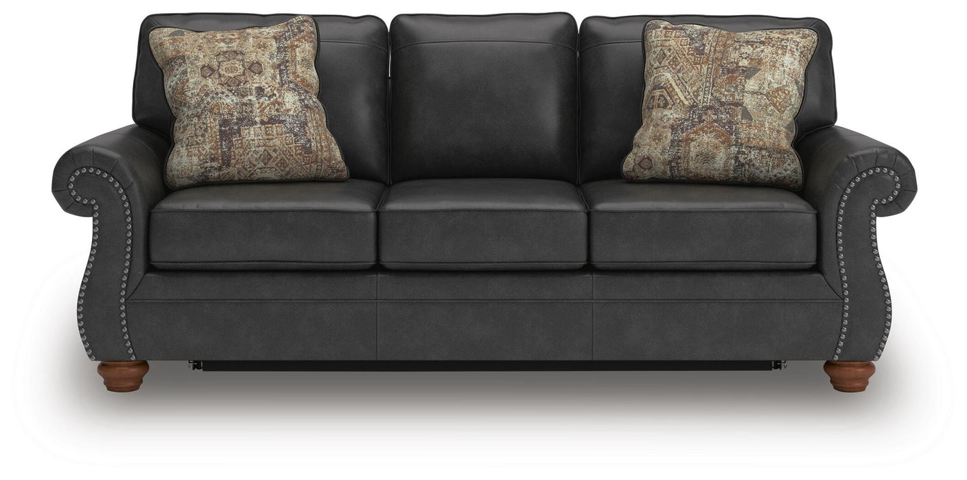 Ashley Furniture Chasemore sleeper sofa with plush upholstery and a functional fold-out bed, shown from head-on view.