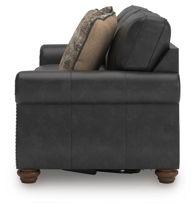 Ashley Furniture Chasemore sofa sleeper with dark upholstery, showcasing the side view of the convertible sleeper sofa.