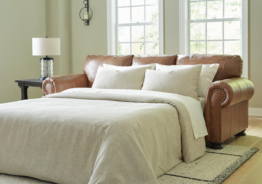 Ashley Furniture Carianna sofa sleeper with plush fabric, featuring a fold-out bed and stylish design for versatile living space.