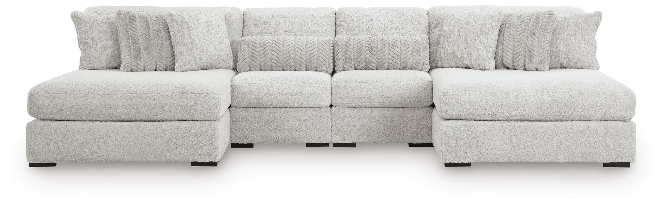 Ashley Furniture Cuddle Plush sectional with chaise, featuring soft cushions and fabric upholstery in a cozy living room setting.