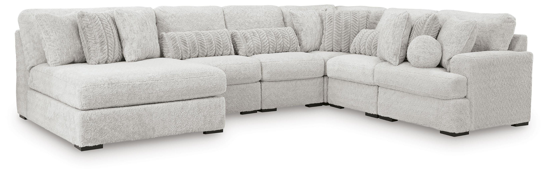 Ashley Furniture cuddle plush sectional with chaise, featuring soft upholstery and comfortable seating in a modern living room setting.
