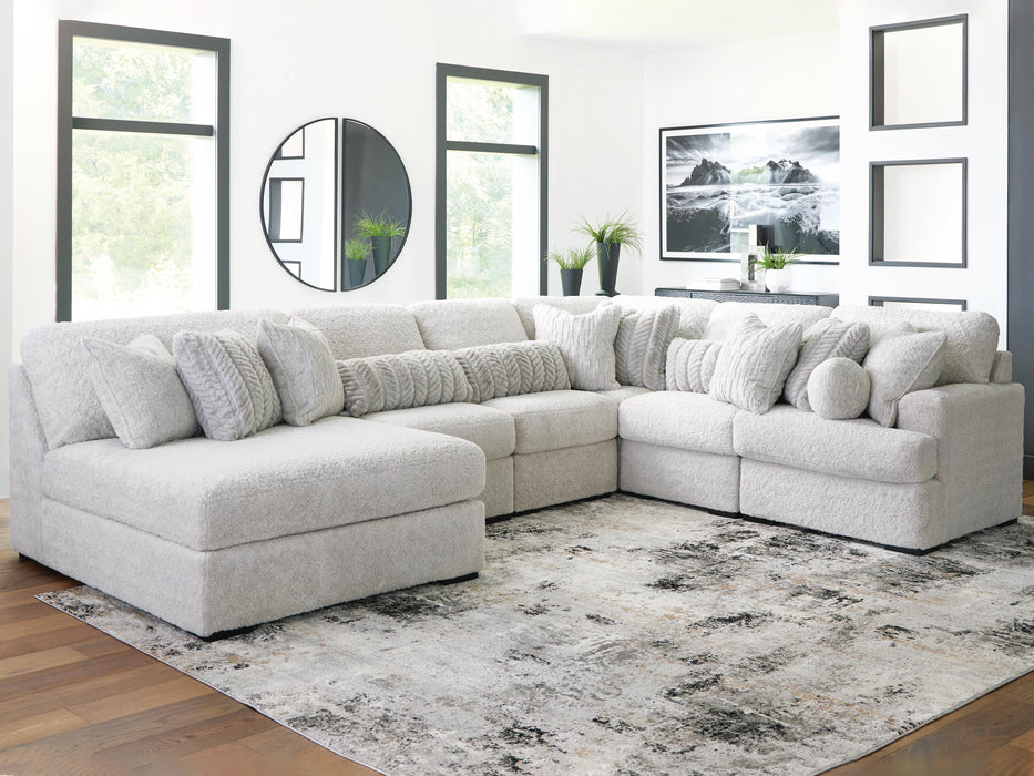 Ashley Furniture cuddle plush sectional with chaise, featuring soft fabric upholstery and modern design for comfortable living space.